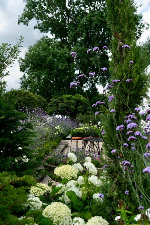 Secluded seating area in garden design at Monkey Island Hotel, Berkshire